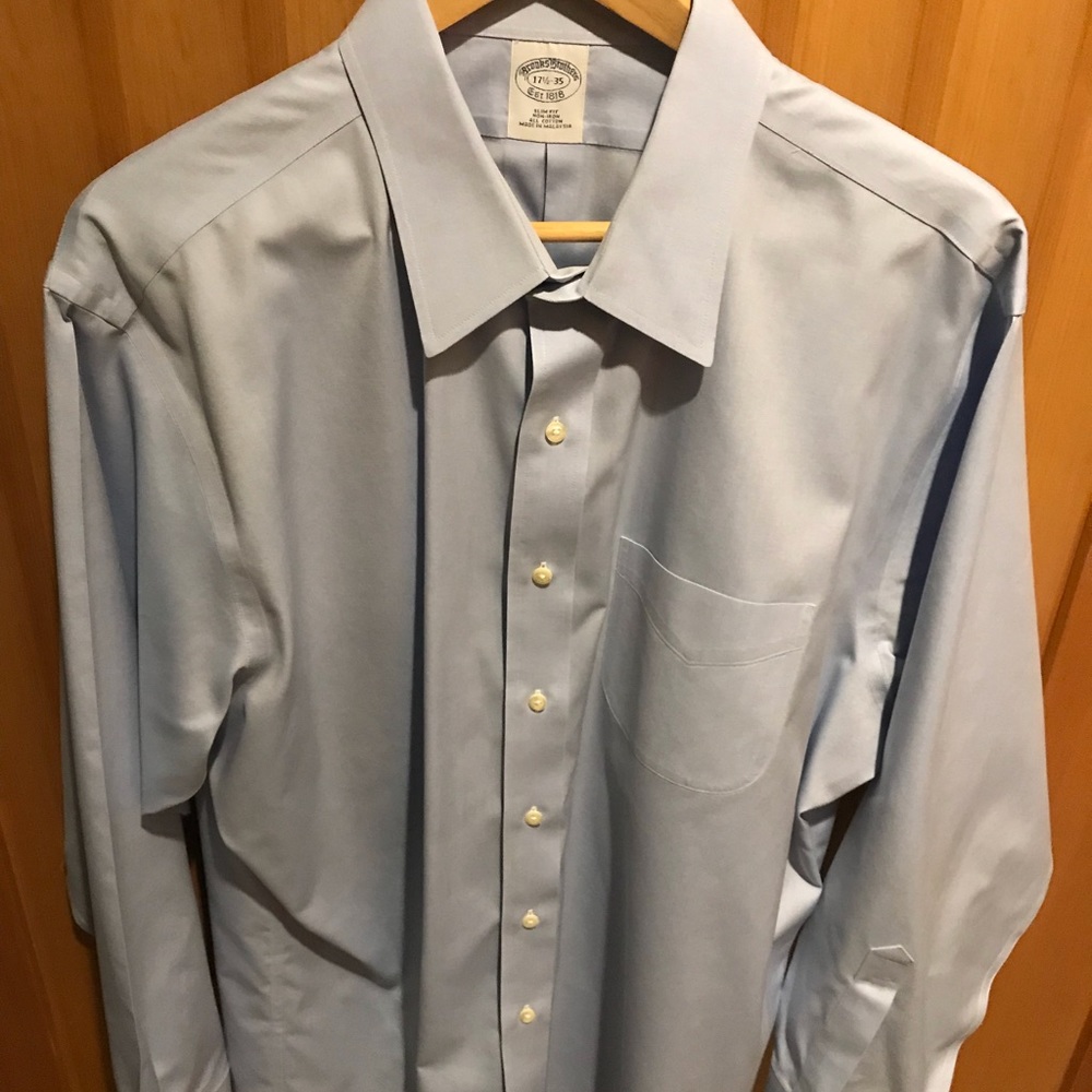Men’s light blue long sleeve button up shirt.